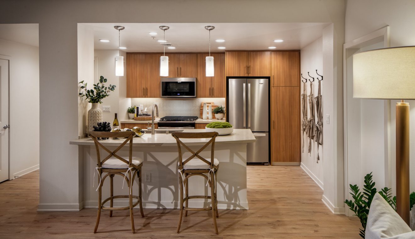 Interior view of kitchen at Delrey at The Village at Irvine Spectrum Apartment Homes in Irvine, CA.
