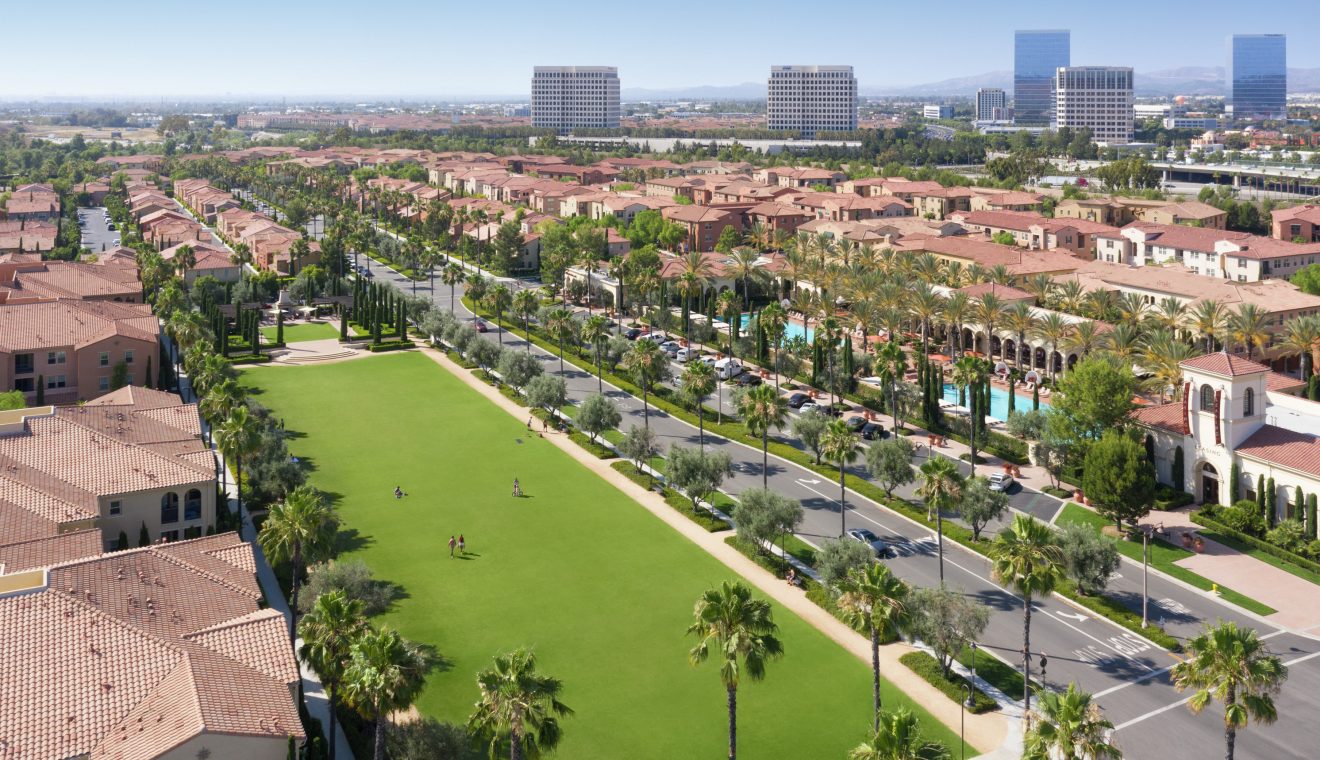 Aerial view of people at courtyard at Los Olivos at Irvine Spectrum Apartment Homes in Irvine, CA.